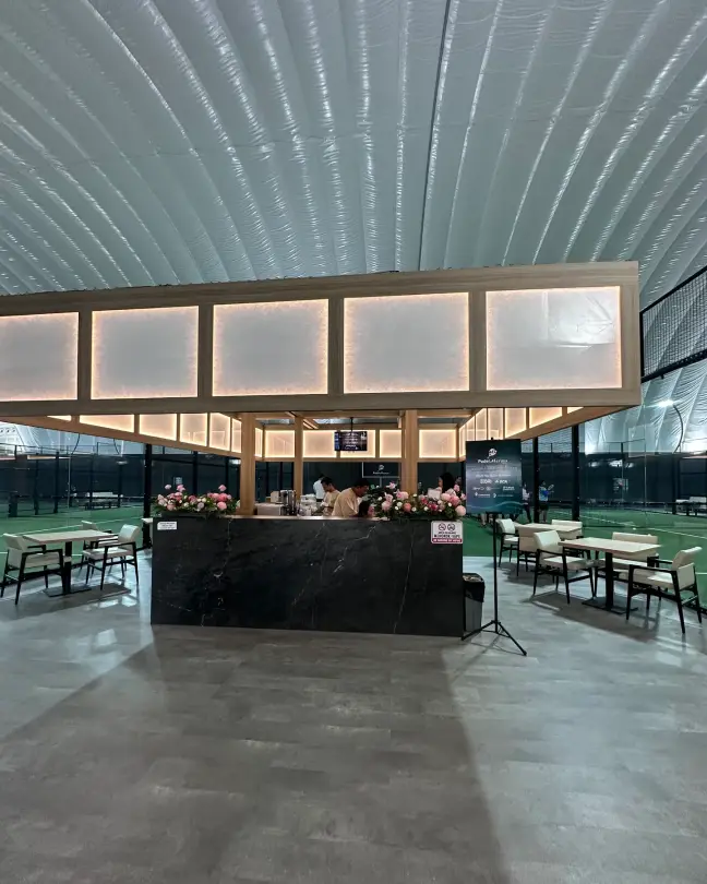 The central café pavilion with lit timber frame