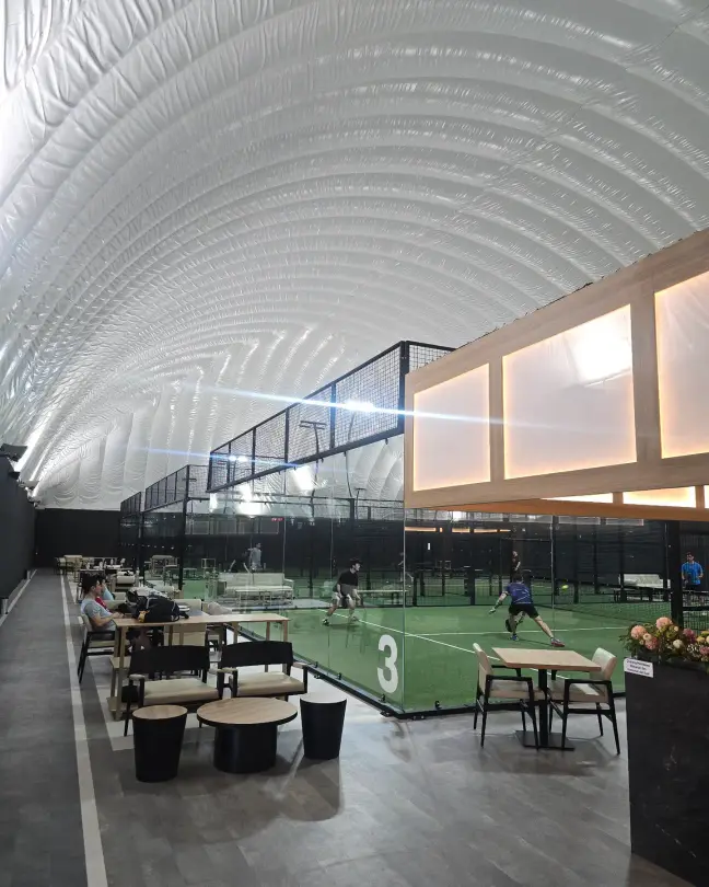 The quilted white Airdome arching over the courts